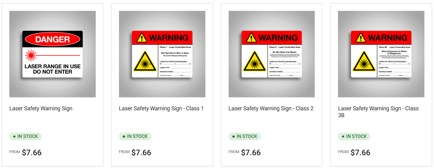 Four images of laser safety warning signs with pricing and availability information below each.